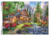 This 1000 piece Weekend Retreat puzzle features an illustration of a rustic cabin with a breathtaking mountain tableau behind it. In front of the cabin a man fishes in an idyllic mountain stream, and a bald eagle soars overhead.