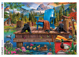 This charming 1000 piece Weekend Retreat puzzle features an illustration of a pair of black Labrador puppies hanging out on a wooden fishing dock. Behind them sits an adirondack chair with a blanket, a pair of binoculars and a still-steaming mug of tea or coffee. A family of ducks crosses the water just in front of the dock, and a majestic mountain rises behind it all. 